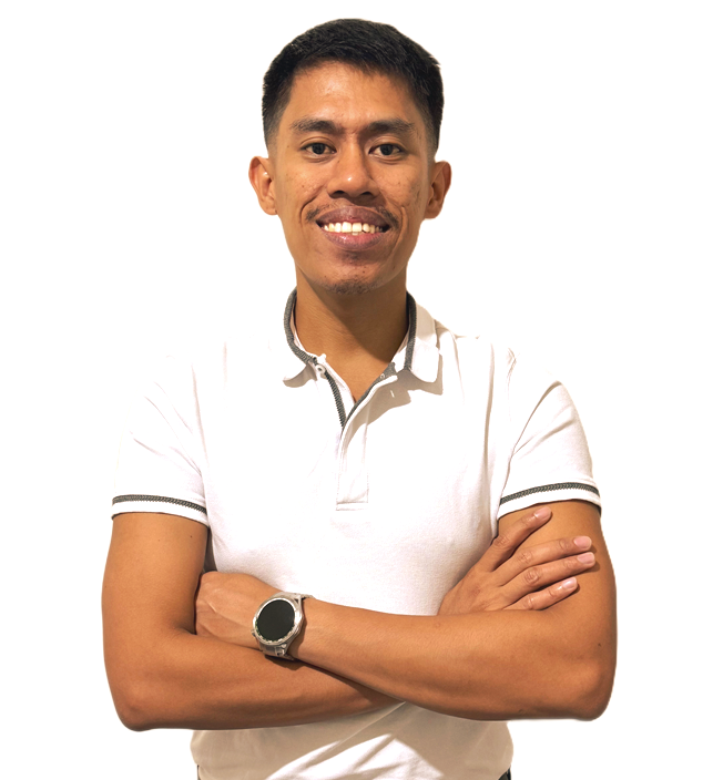 A person with a smiling expression, wearing a white polo shirt and a watch, stands with arms crossed against a white backdrop.