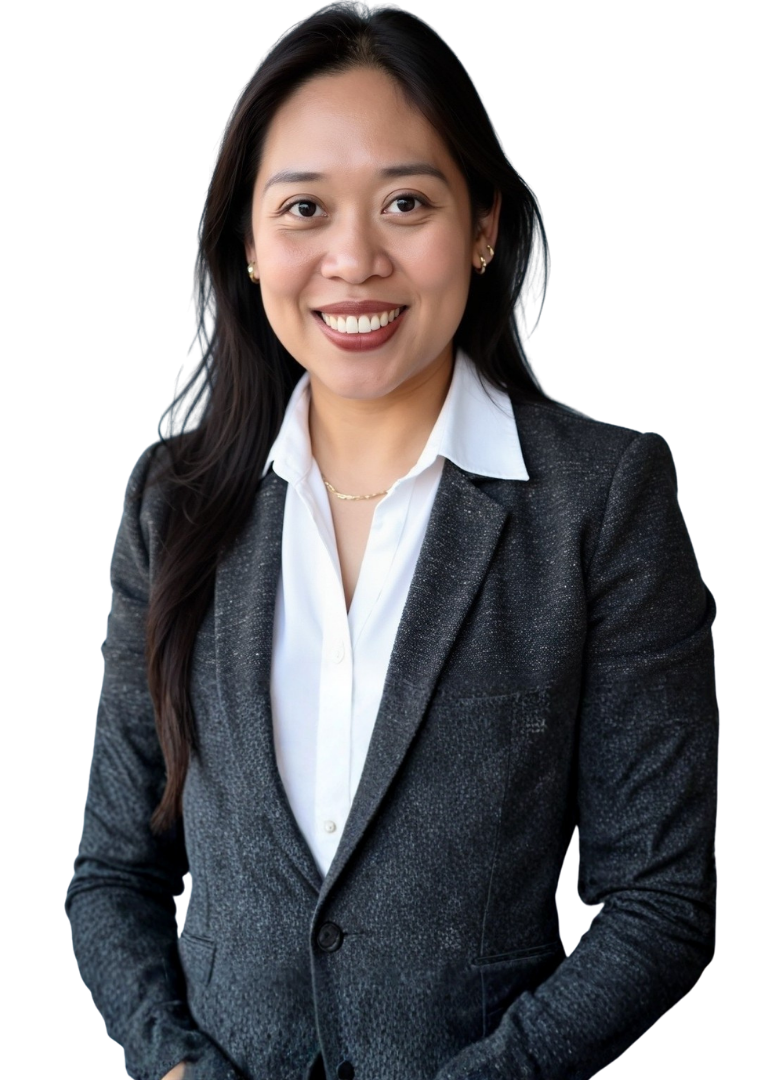 Woman with black hair, crossed arms, wearing a grey plaid blazer and white shirt.