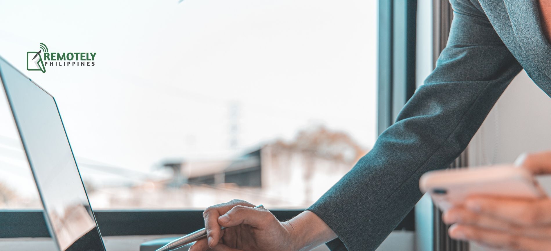 person working on laptop for busy season