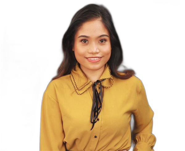 A person with dark hair smiling at the camera, wearing a mustard-yellow button-down shirt against a plain black background.