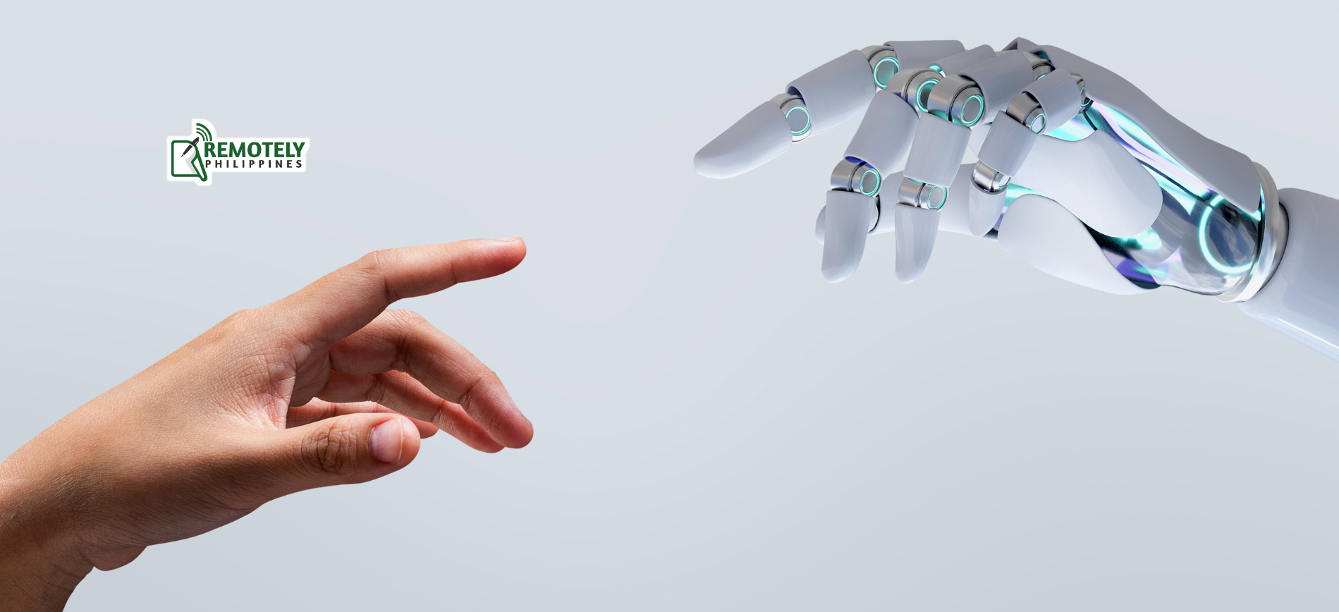 A person is touching a robot 's hand with their finger.