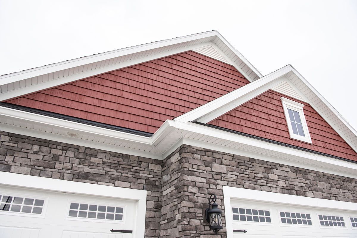 A house with a red roof and white trim