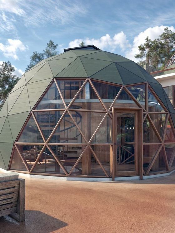 Impresión artística de una casa abovedada con escalera de caracol.