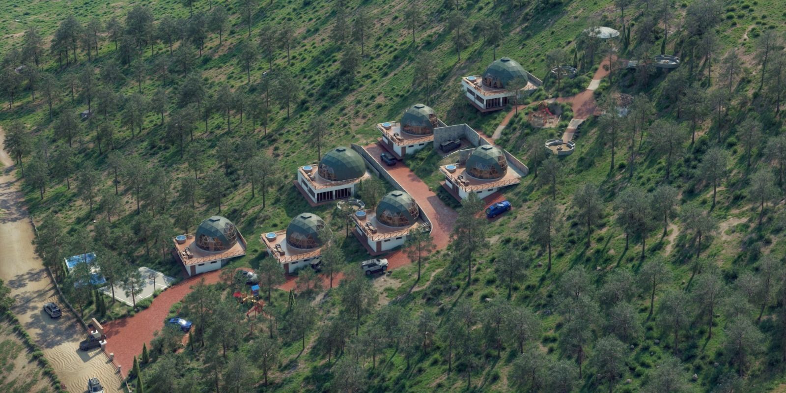 Una vista aérea de un grupo de casas en medio de un bosque.