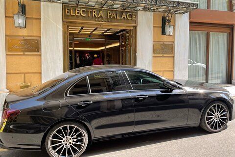 VIP passengers being welcomed into a luxury car for a seamless transfer from Athens to Lefkada