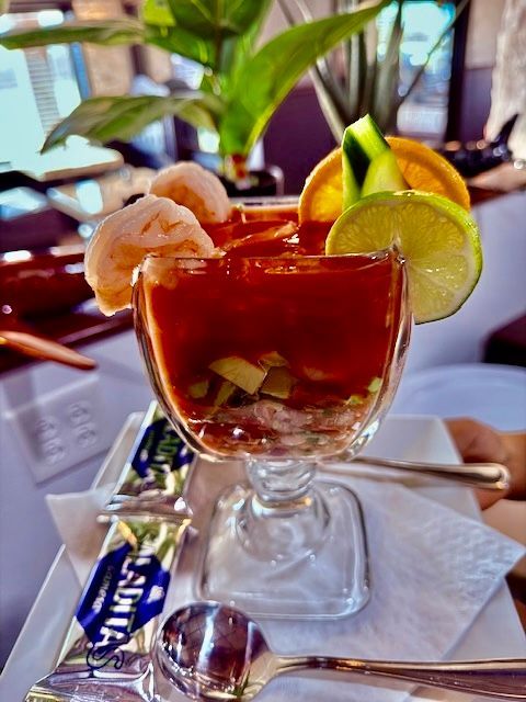 A close up of a shrimp cocktail in a glass