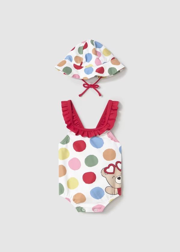 Completo costume da bagno e cappello a pois bianchi con rifiniture rosse e grafica a forma di orso.