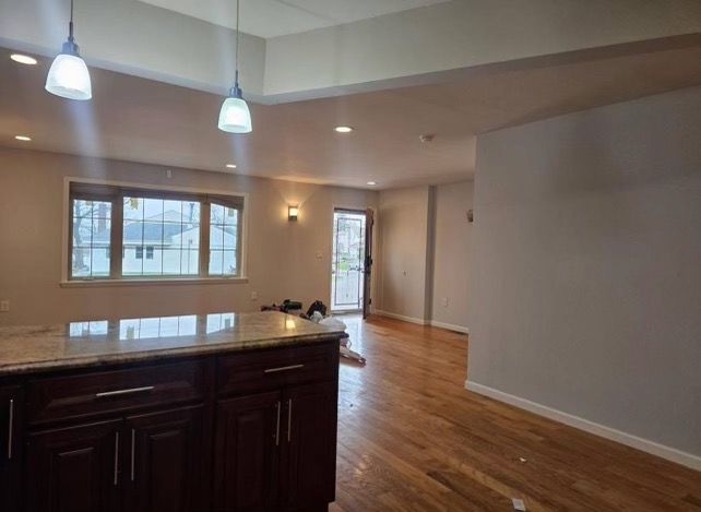 A kitchen with a large island in the middle of the room.
