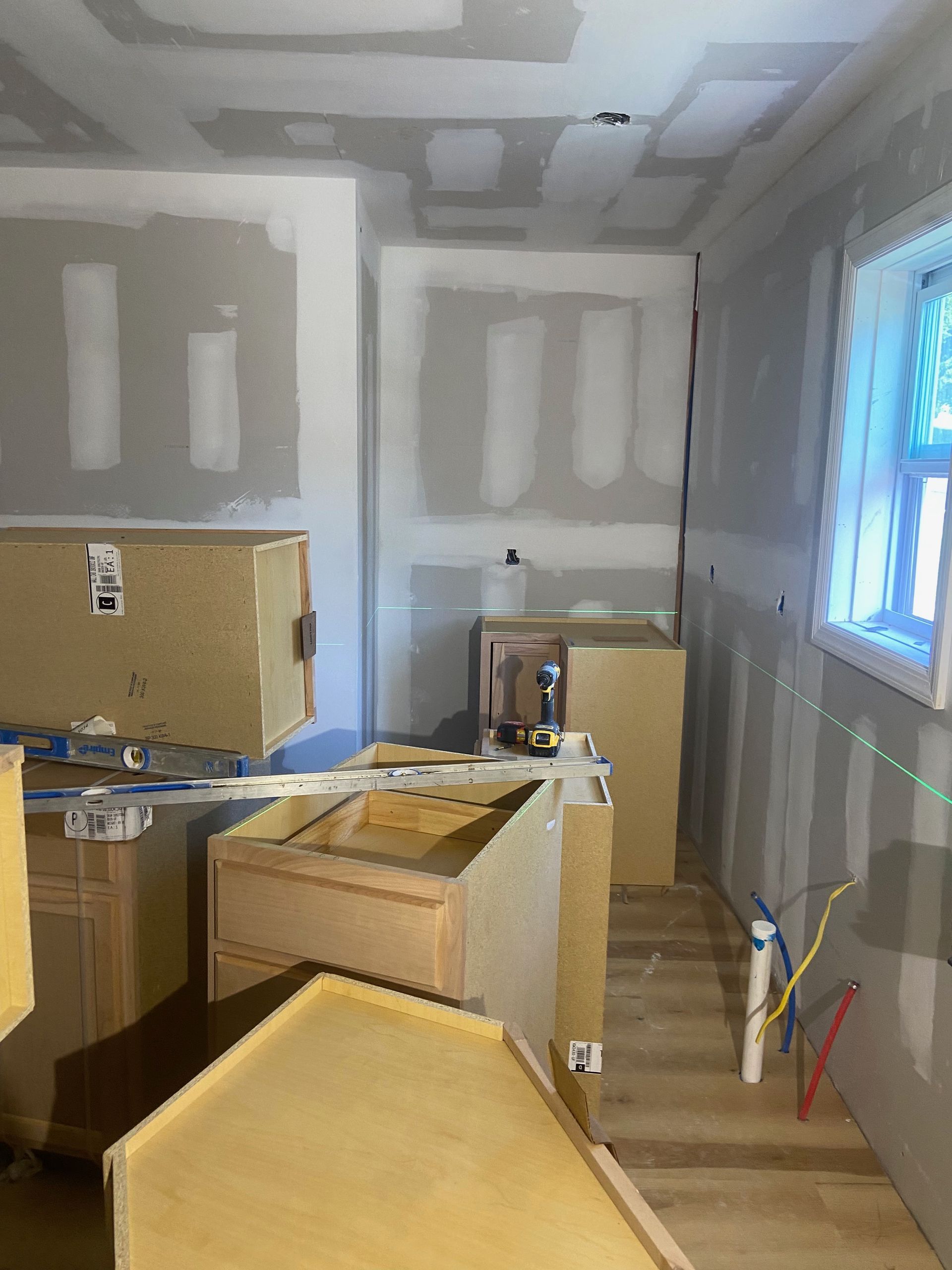 A room that is being remodeled with boxes on the floor