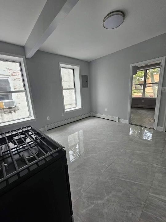 There is a stove in the middle of the room.