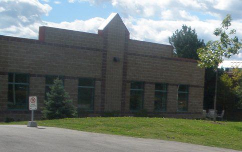 A brick building with a no parking sign in front of it