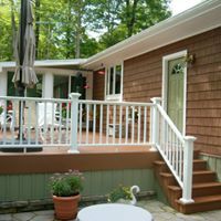 Deck Construction — Deck With White Fence And Stairs in Pittsfield, PA