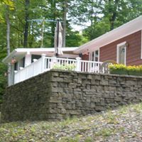 Deck Design — Deck Made Of Bricks And White Fence in Pittsfield, PA