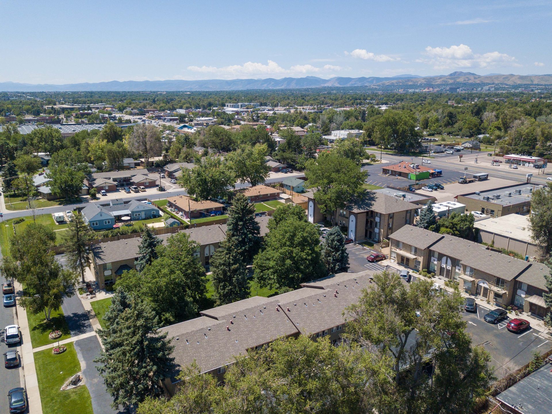 An aerial view of a city with mountains in the background.