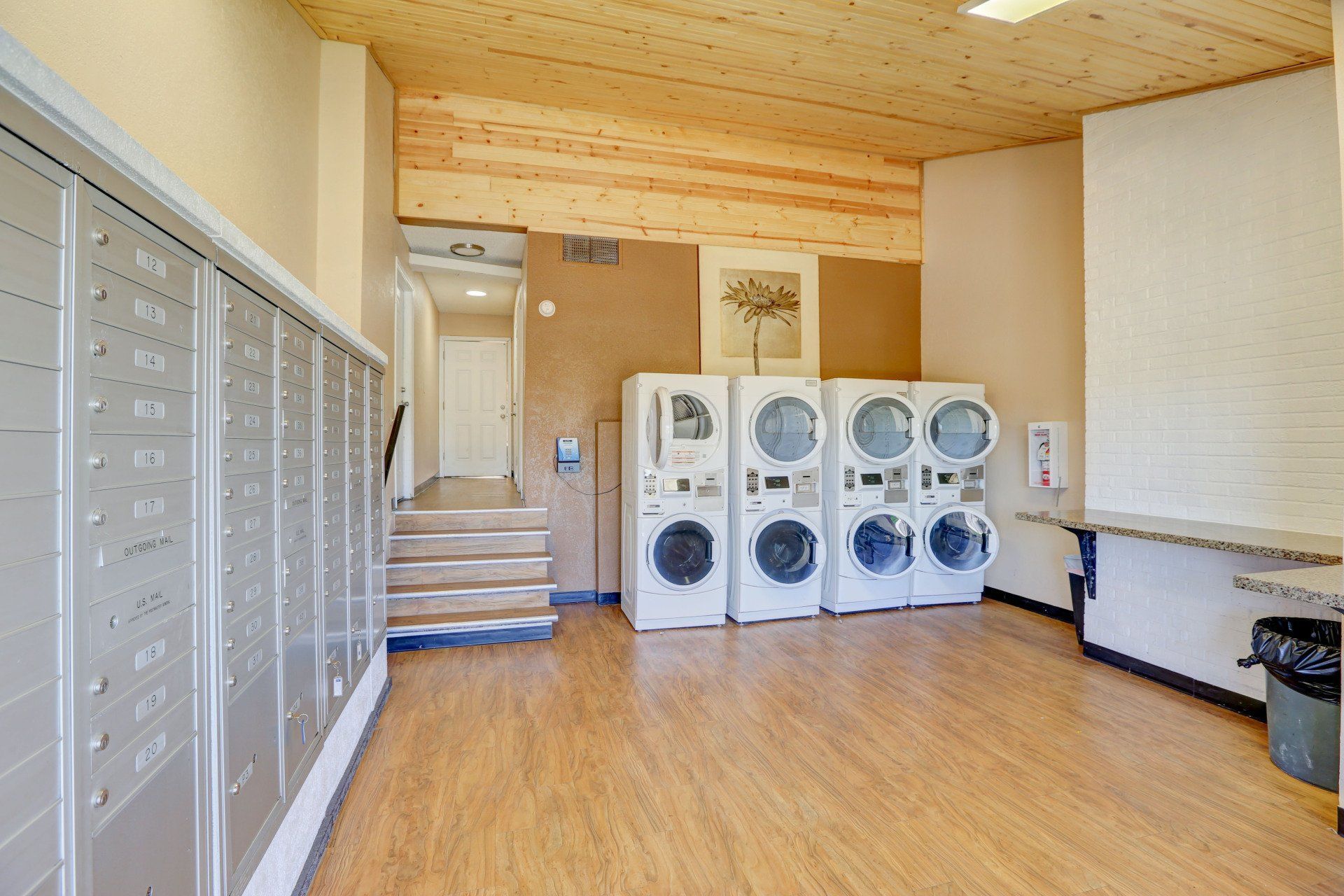A laundromat with a lot of washers and dryers