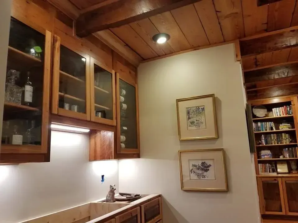 A kitchen with wooden cabinets and a sink