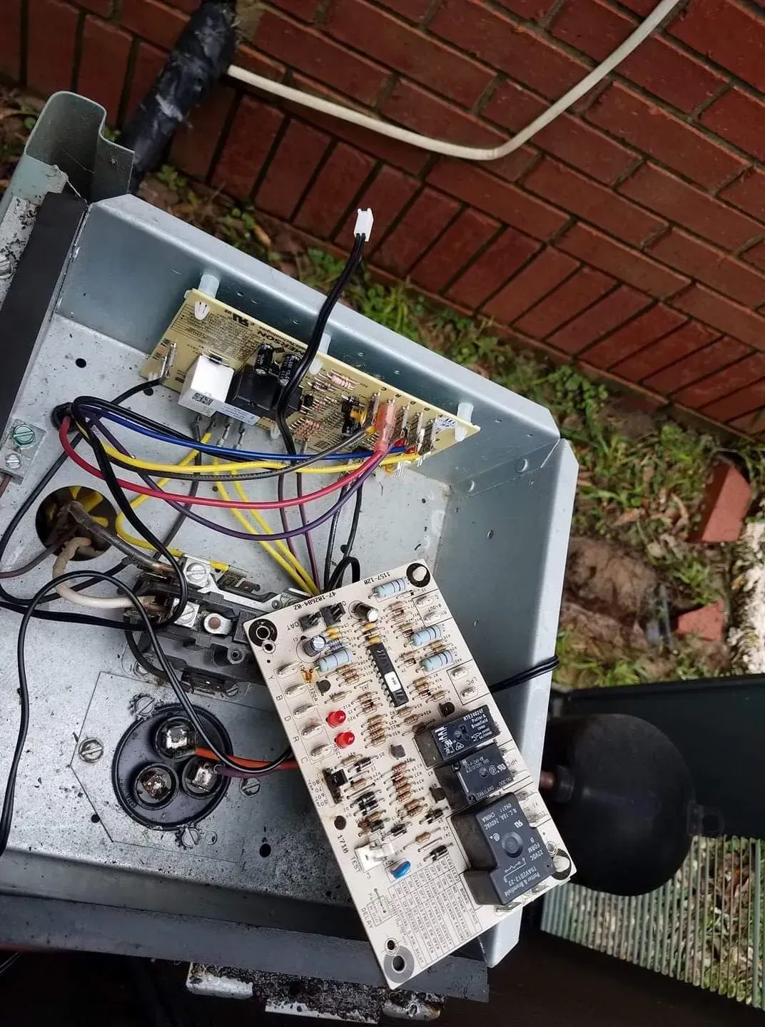 A box with a bunch of wires coming out of it