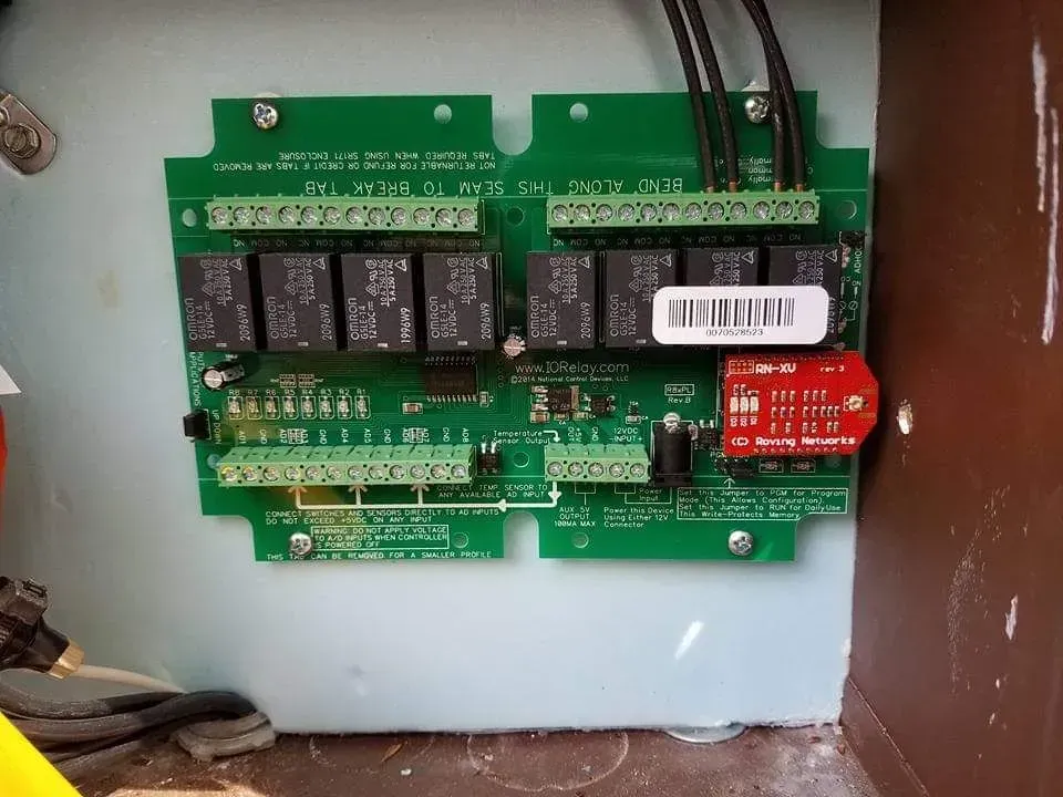A close up of a circuit board with a barcode on it