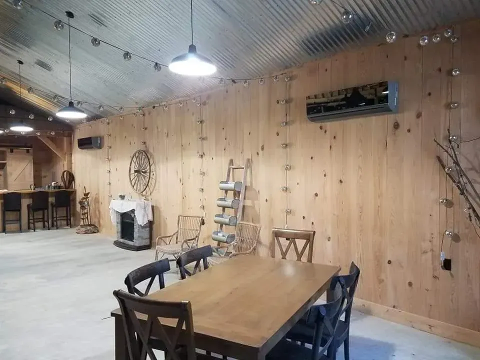 A large room with a table and chairs in it