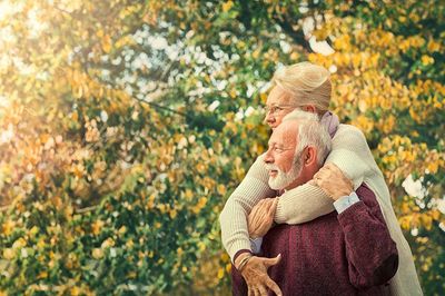 Senior Couple Against Autumn Background — Parker, CO — A Houdek Counselings