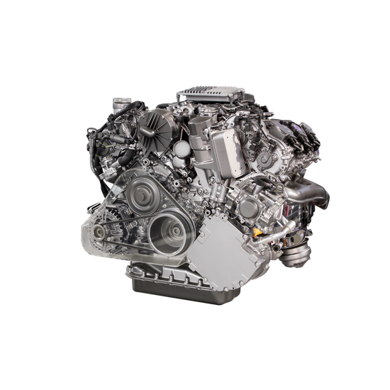 A silver car engine isolated on a white background.