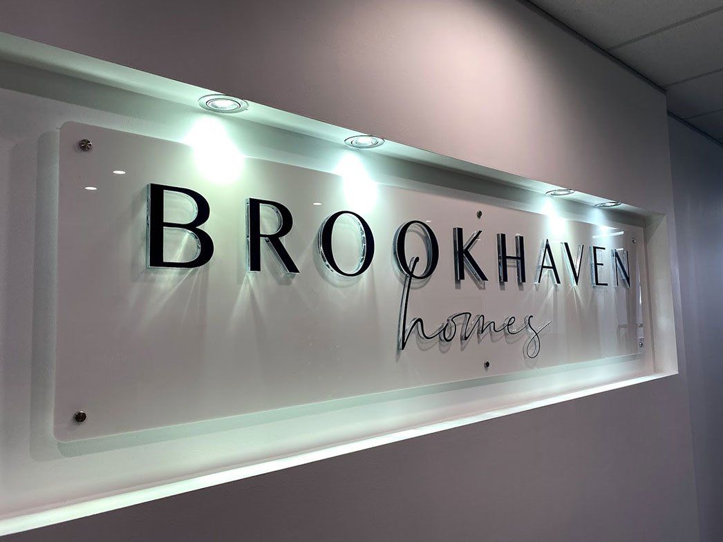Brookhaven Homes Logo On A White Wall — Signage In Acacia Ridge, QLD