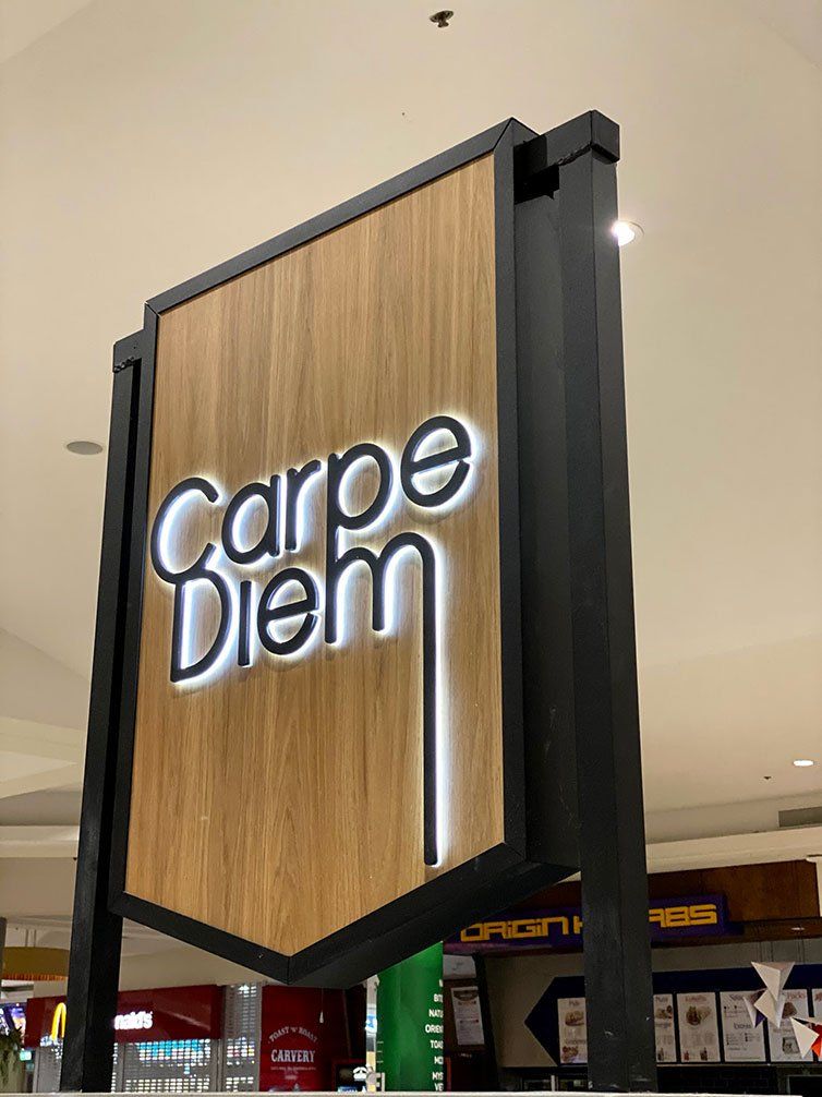 Carpe Diem Logo On Timber — Signage In Acacia Ridge, QLD
