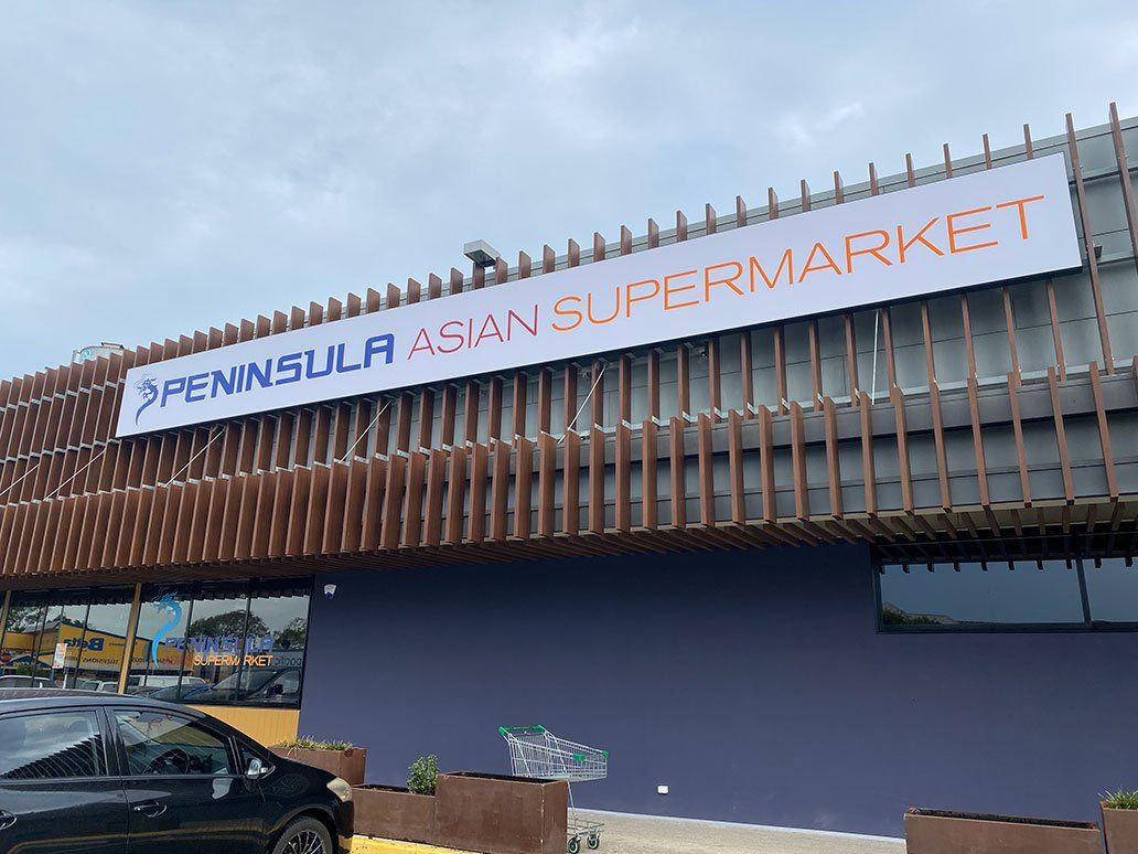 Peninsula Asian Supermarket Logo On White Lightbox — Signage In Acacia Ridge, QLD