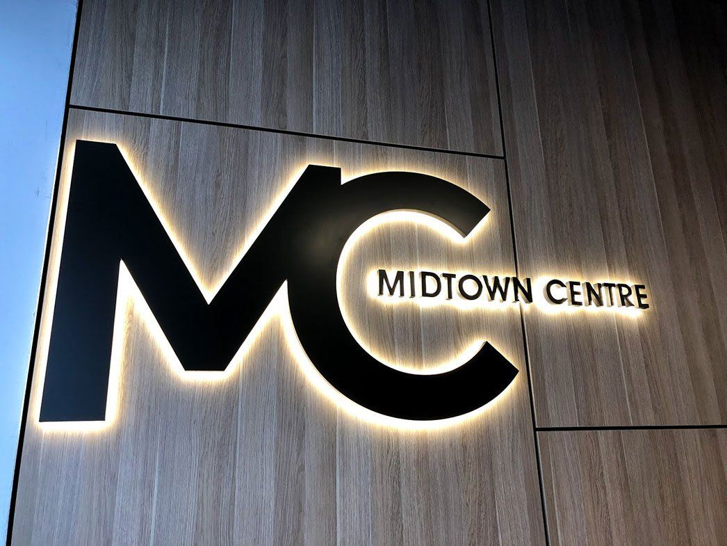 Black Logo With Yellow Backlight — Signage In Acacia Ridge, QLD