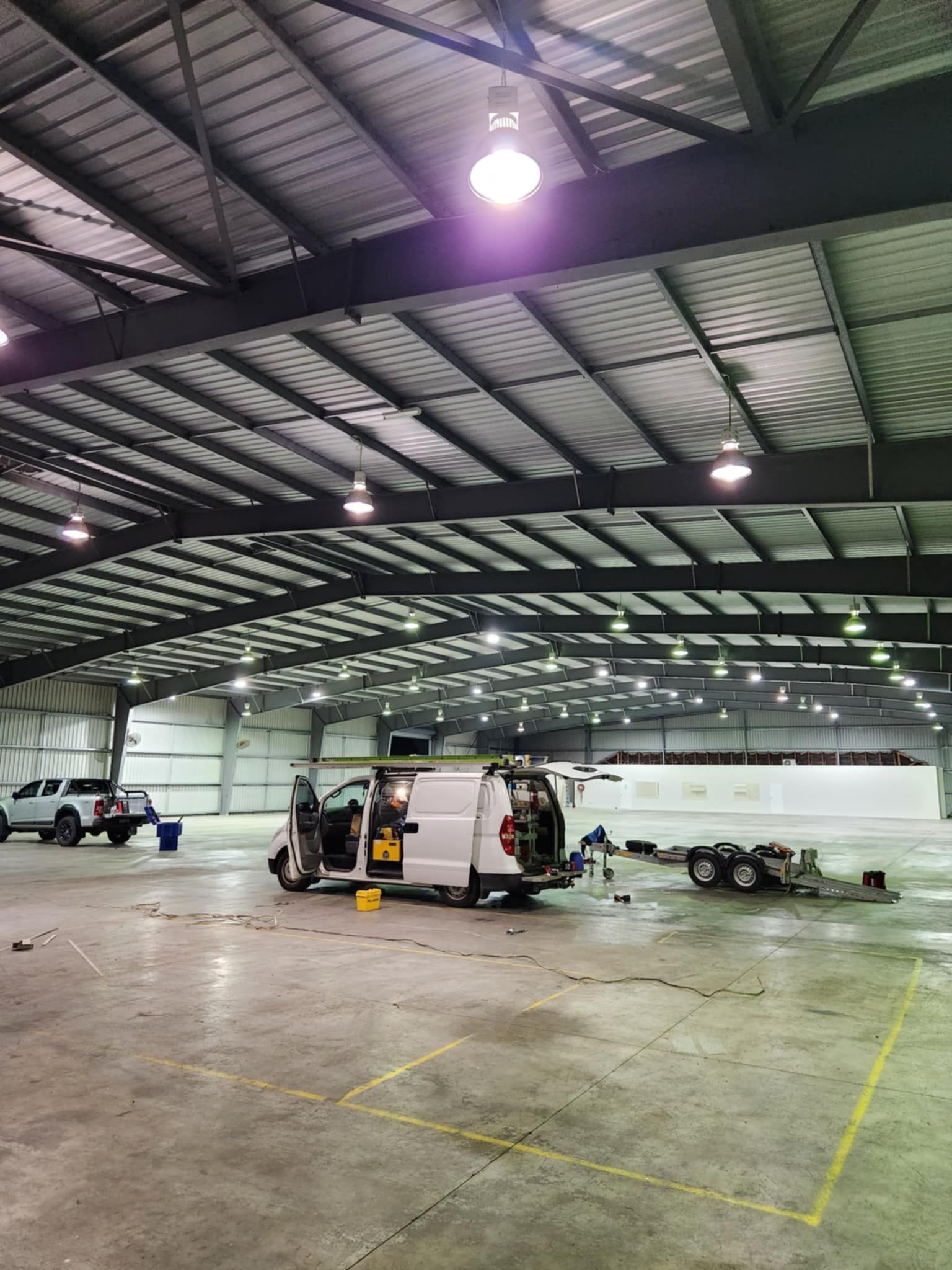 A Electrical Box Is Sitting On Top Of A Pole In A Field — Prowire Services In Walkerston, QLD