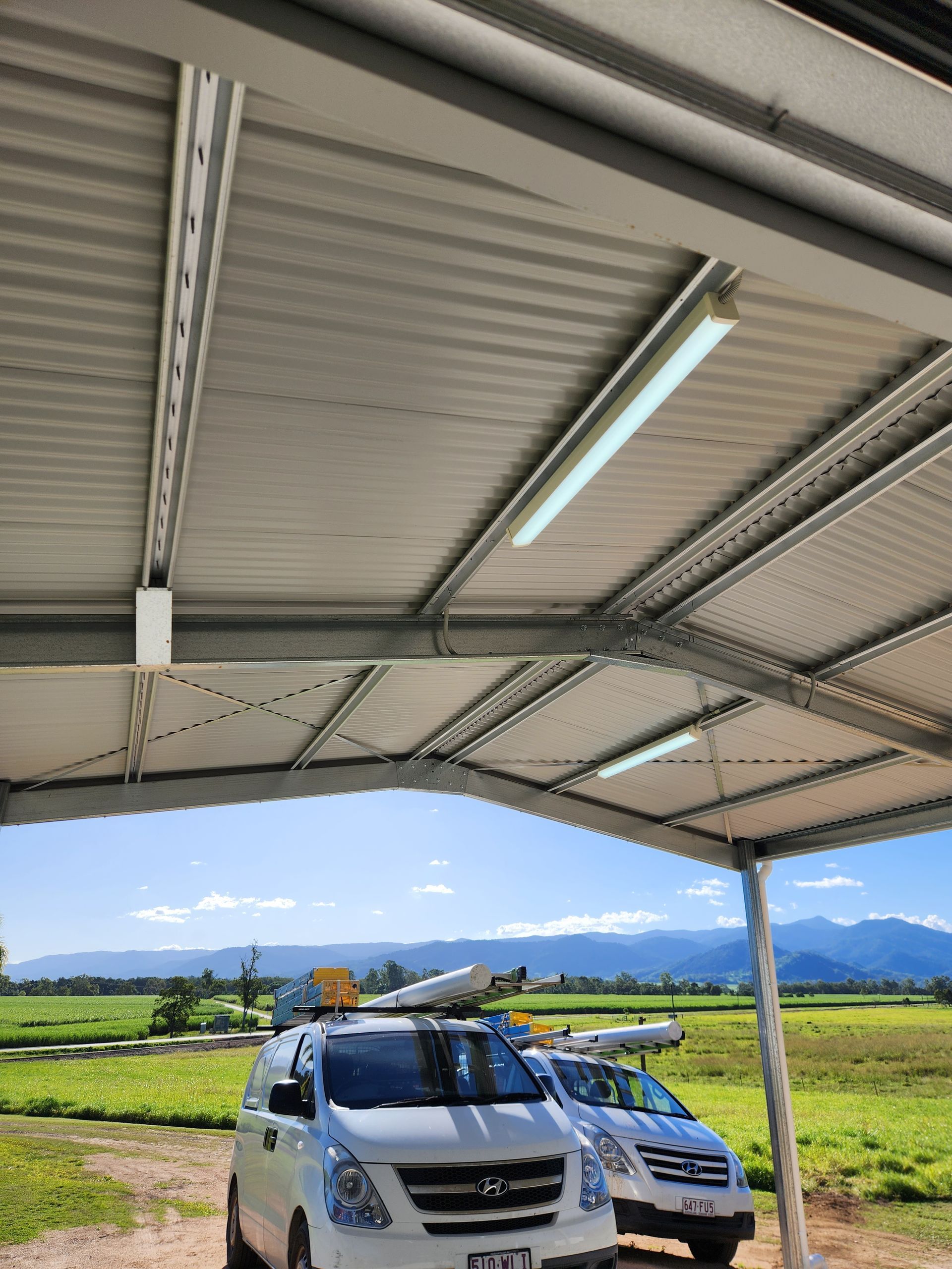 Two Utes In A Field — Prowire Services In Walkerston, QLD
