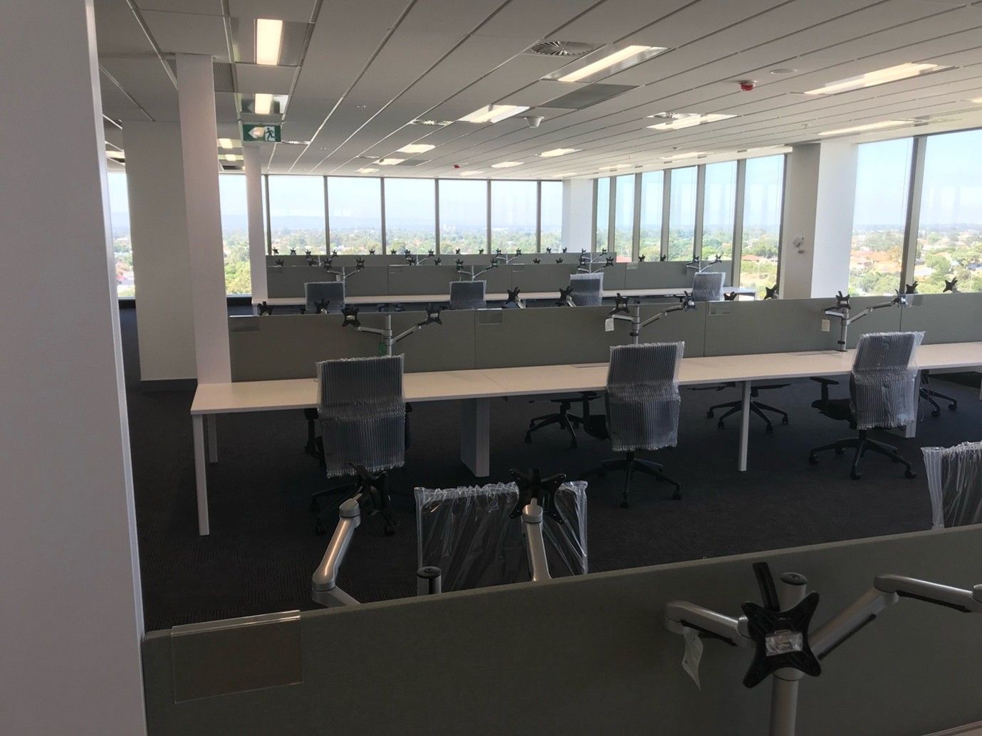 Empty Office With Rows of Desks, Chairs — Perth Electrical & Data in Joondalup, WA