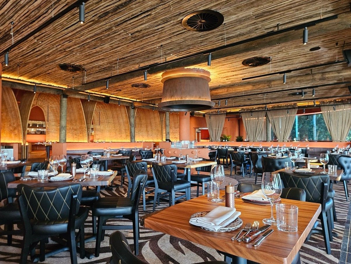 Restaurant Interior With Wood Tables, Black Chairs — Perth Electrical & Data in Joondalup, WA