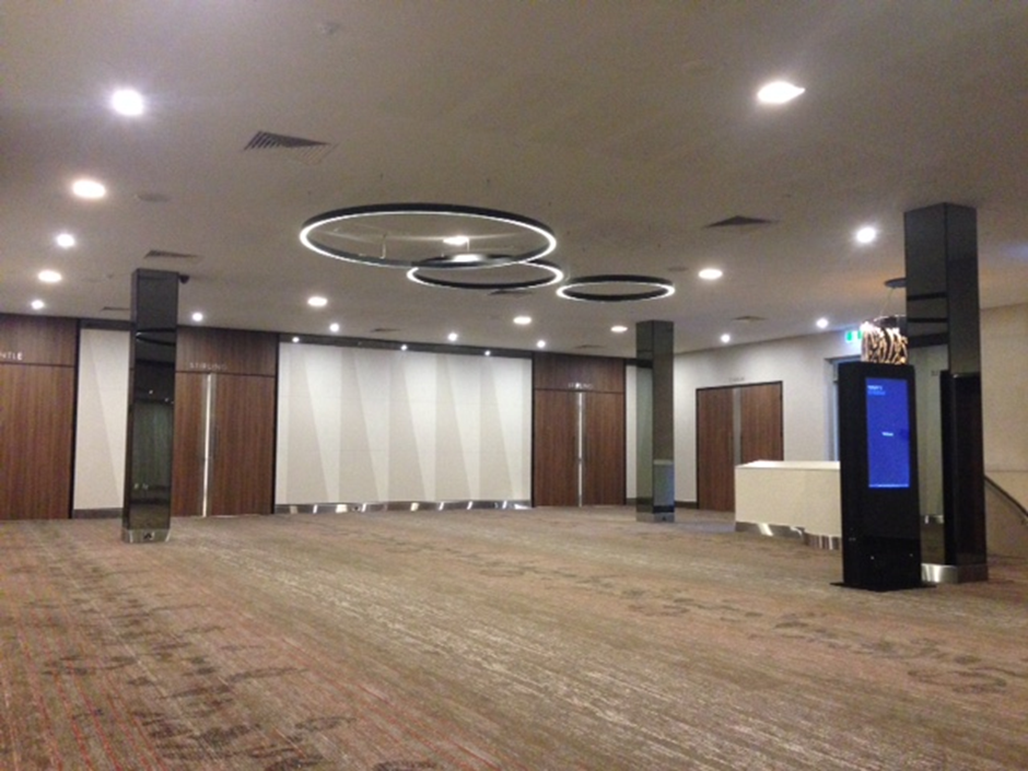 Empty Event Space With Brown Carpet, Wood-paneled Walls — Perth Electrical & Data in Joondalup, WA