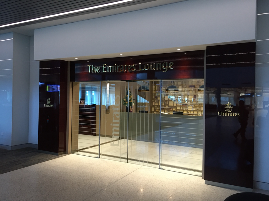Entrance to the Emirates Lounge, With Glass Doors and Dark Wood Accents — Perth Electrical & Data in Joondalup, WA