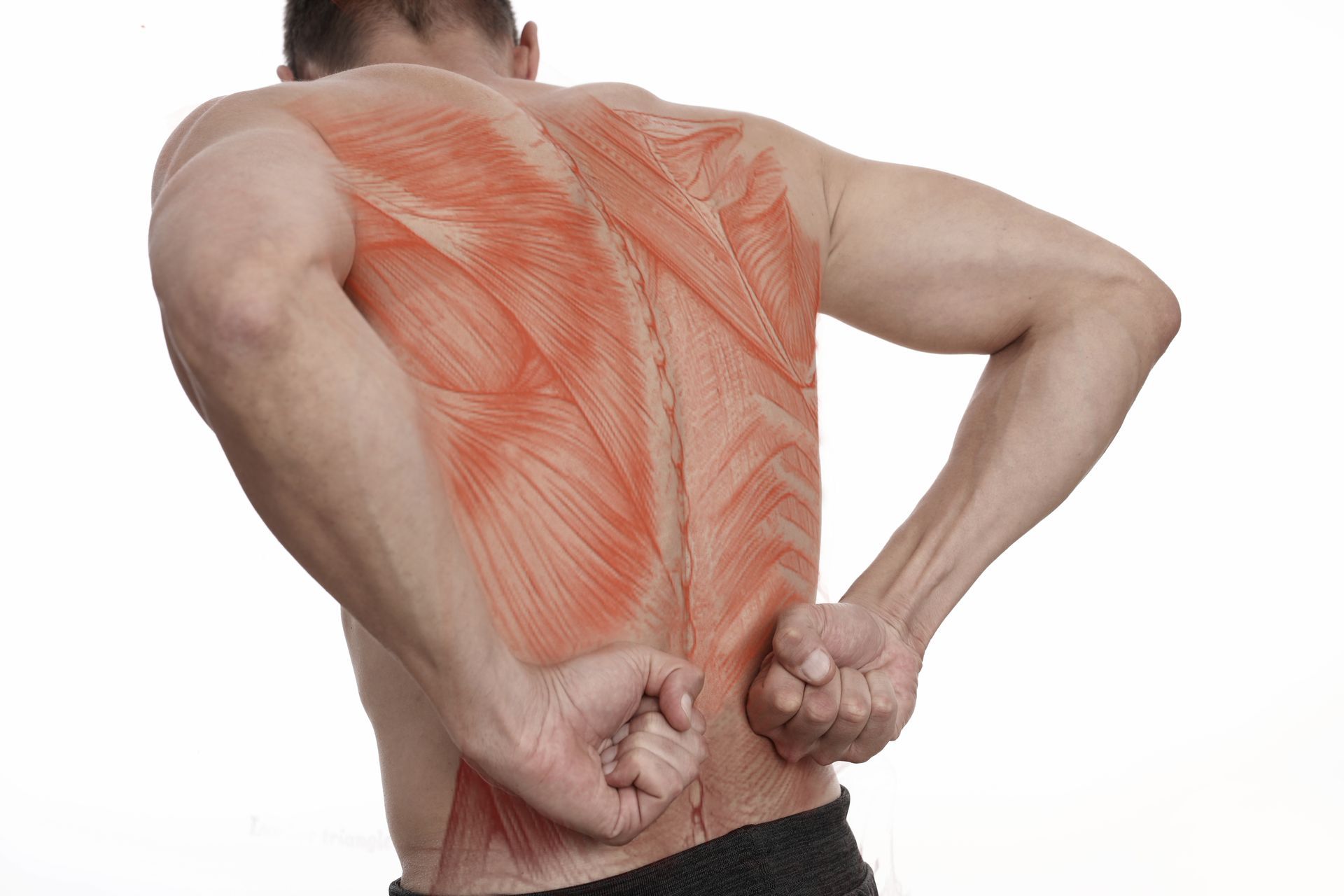 A man is holding his back in pain.