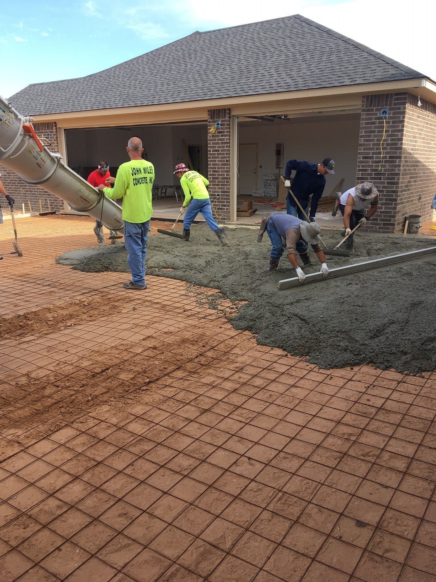 Men Working In Front Of House — Amarillo, TX — Thomas RediMix Co Inc