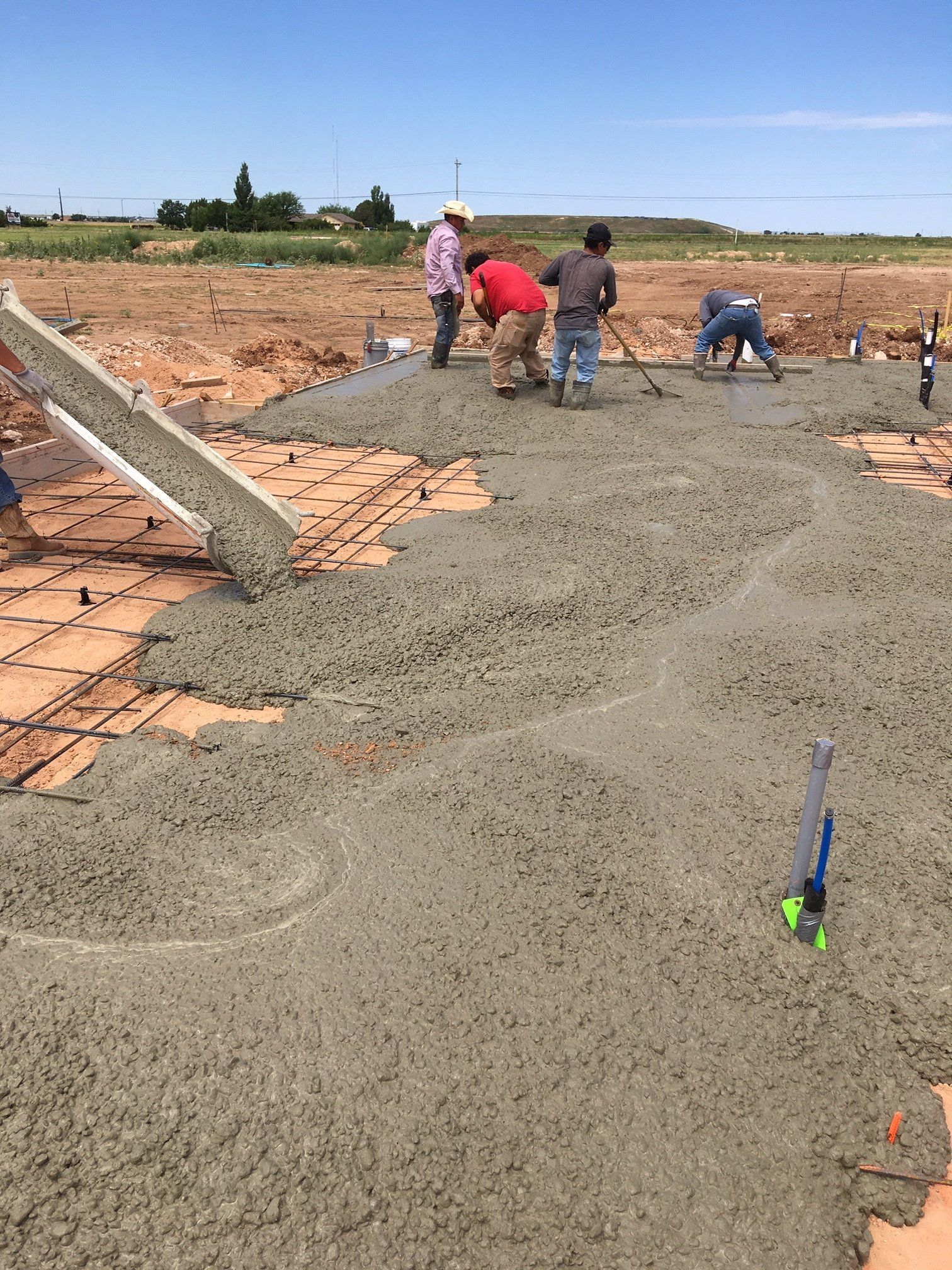 Workers Flattening Concrete — Amarillo, TX — Thomas RediMix Co Inc