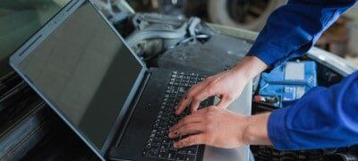 Auto mechanic using laptop - Transmission Services in Pennsville, NJ & Dover, DE