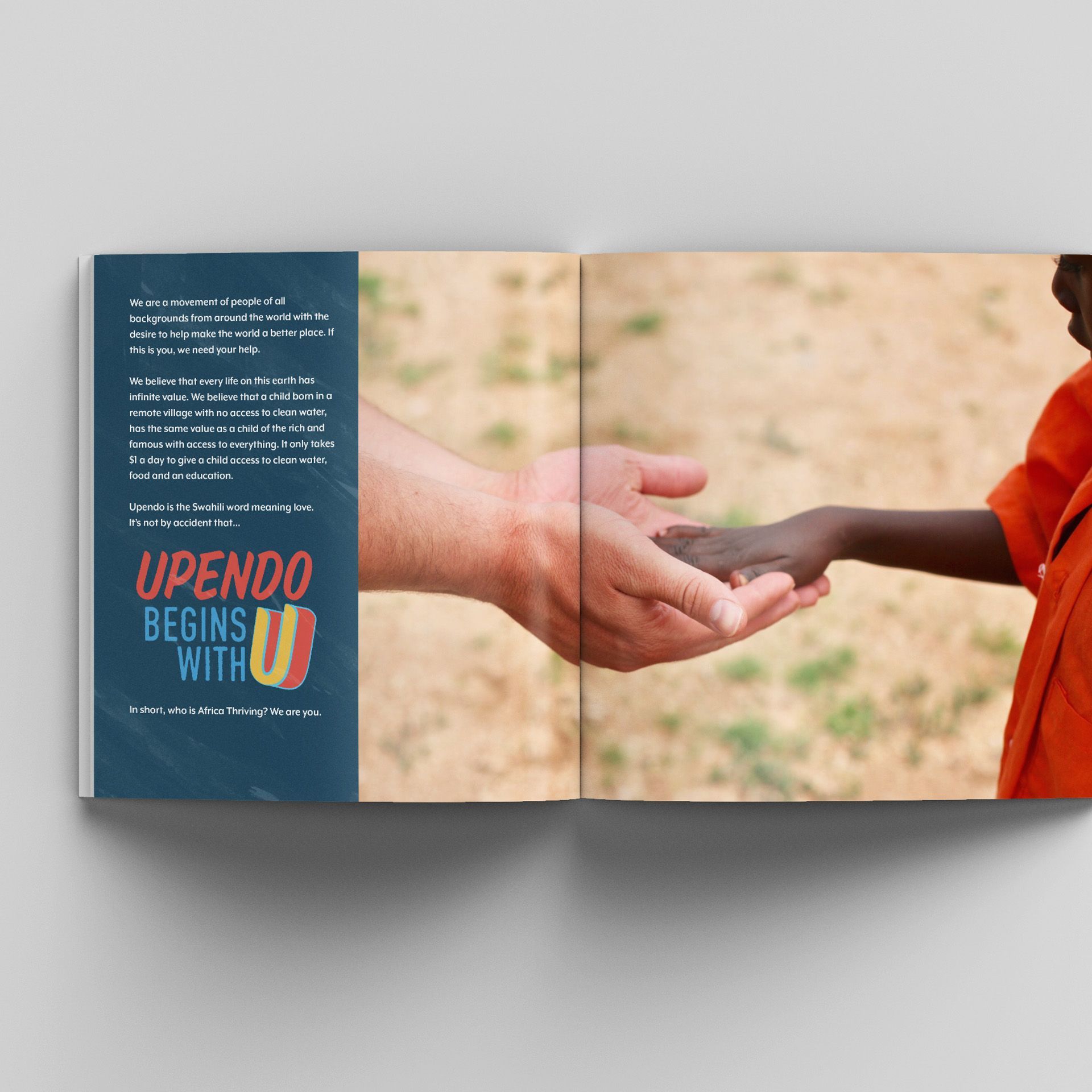 A book is open to a page that says upendo begins with