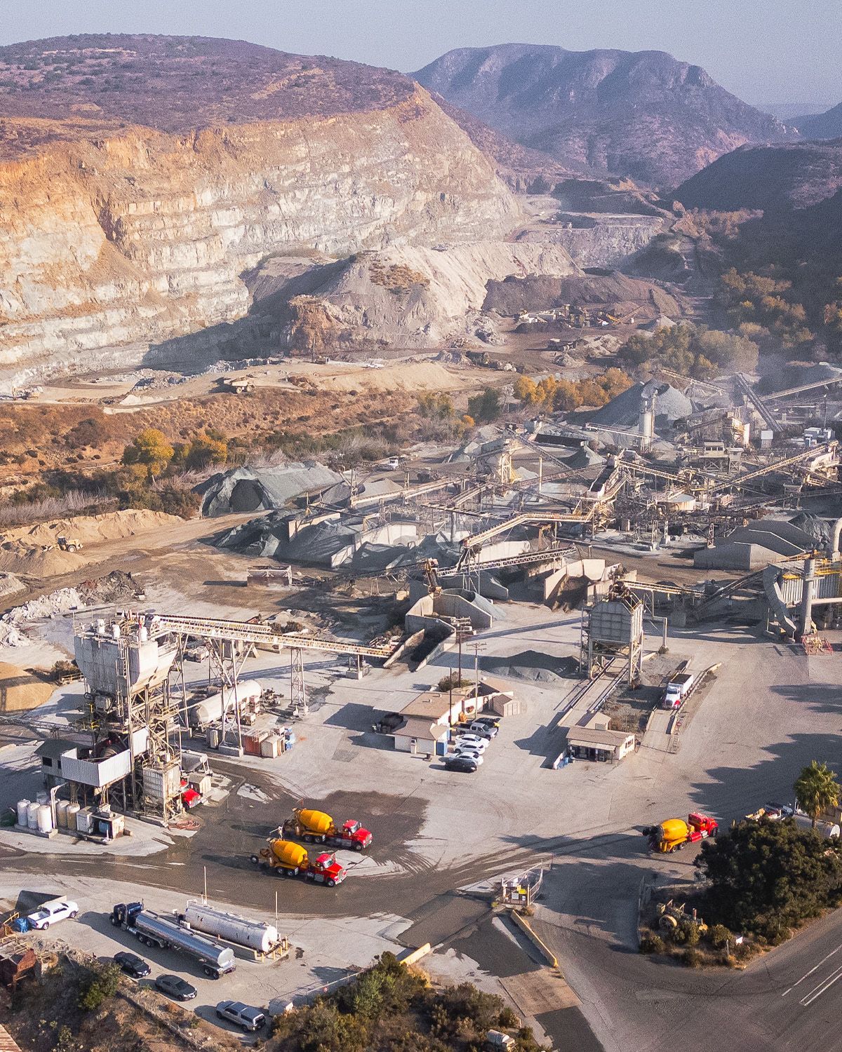 An aerial view of a city with mountains in the background