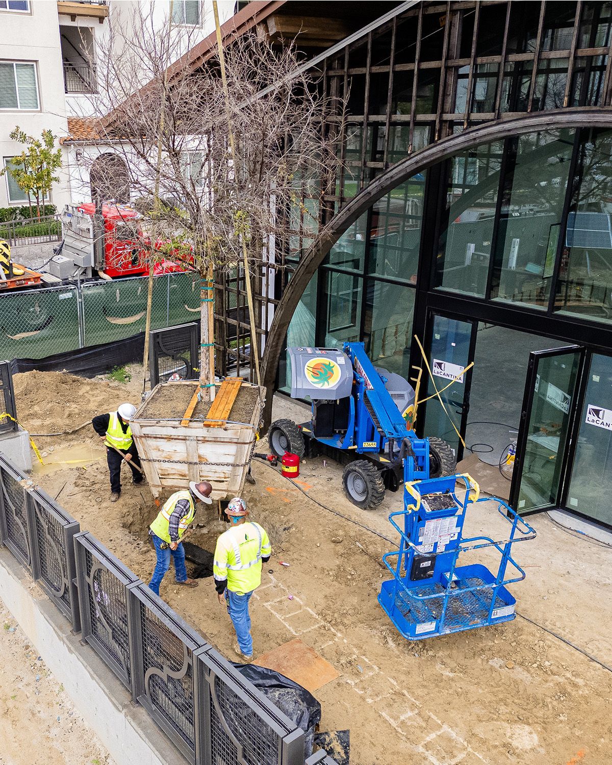 A group of construction workers are working on a building under construction.