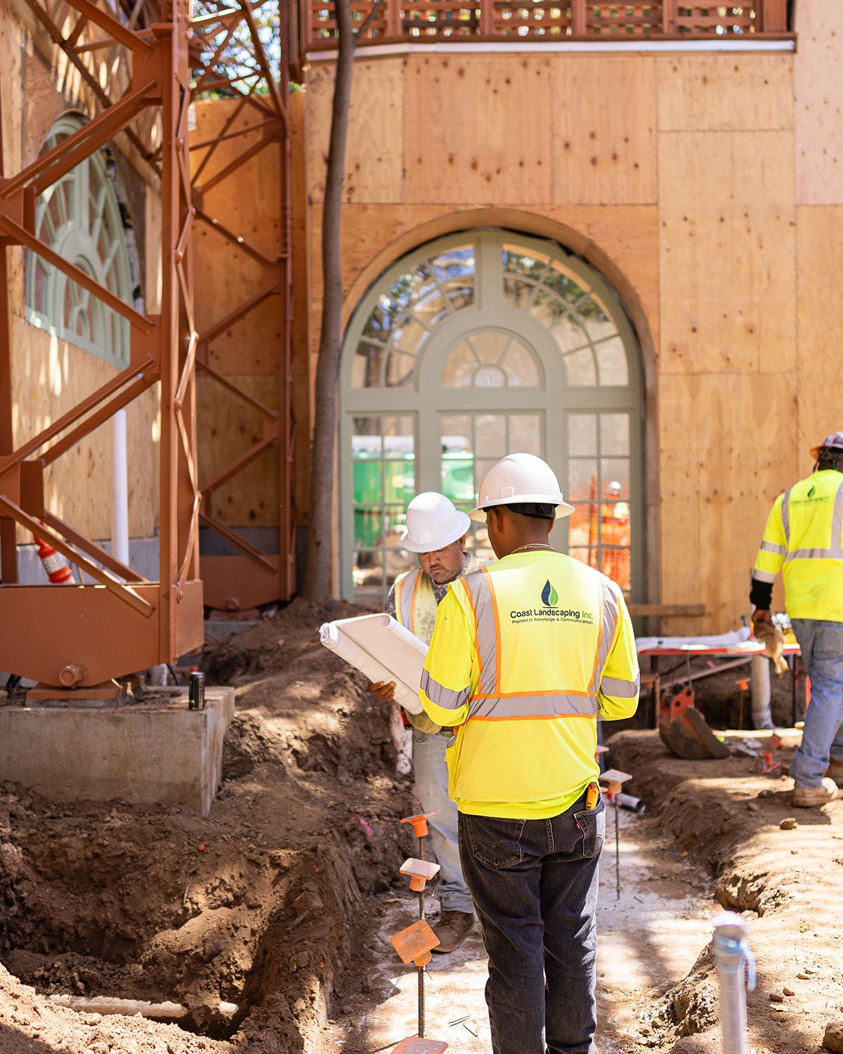A group of construction workers are working on a building
