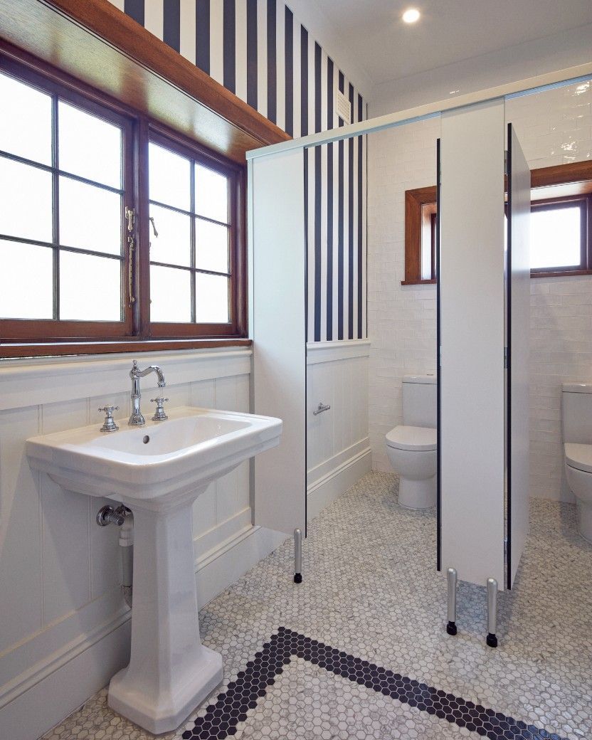 A Bathroom With A White Sink Toilet And Window — Concept Kitchens In Port Macquarie, NSW