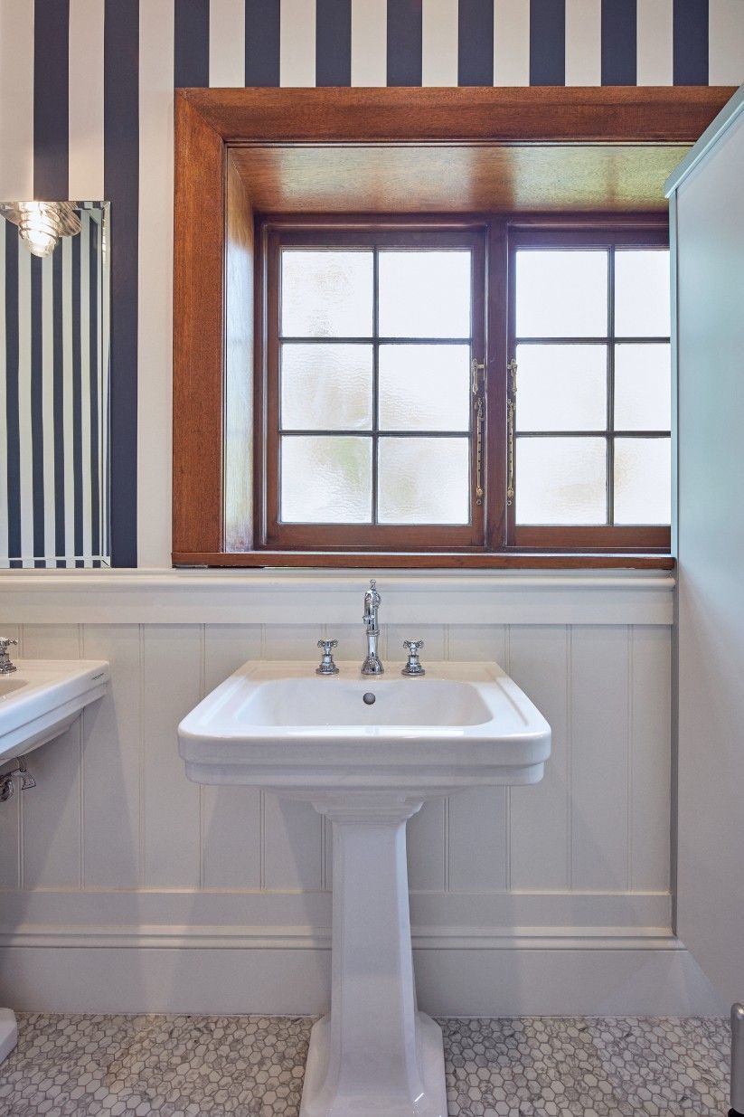 A Bathroom With A Sink And A Window With Striped Wallpaper — Concept Kitchens In Port Macquarie, NSW