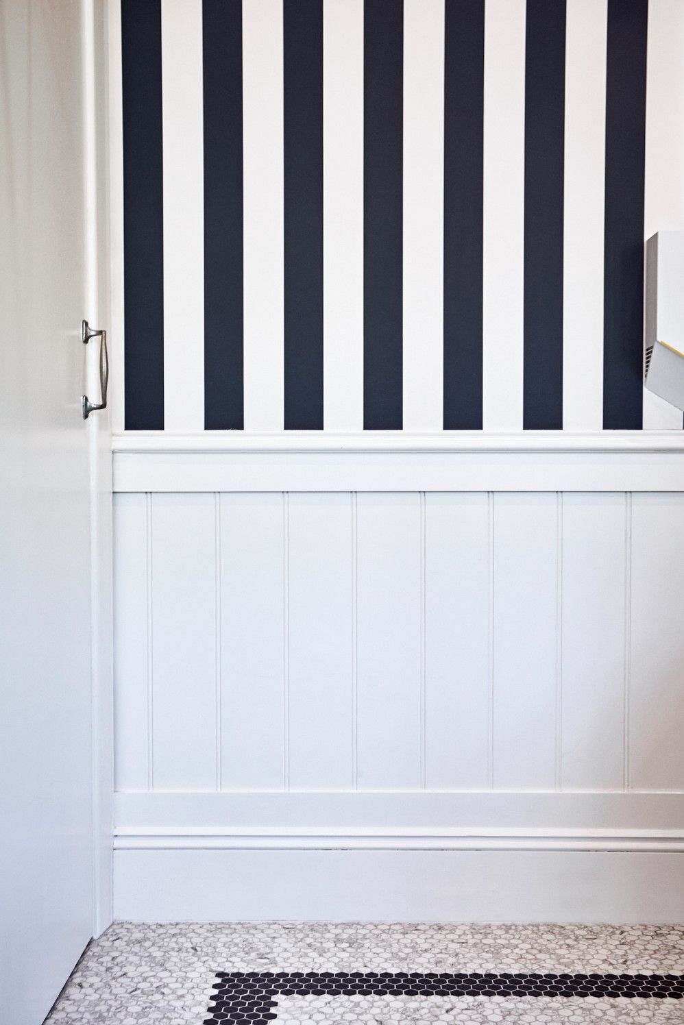 There Is A Black And White Striped Wall In The Bathroom — Concept Kitchens In Port Macquarie, NSW