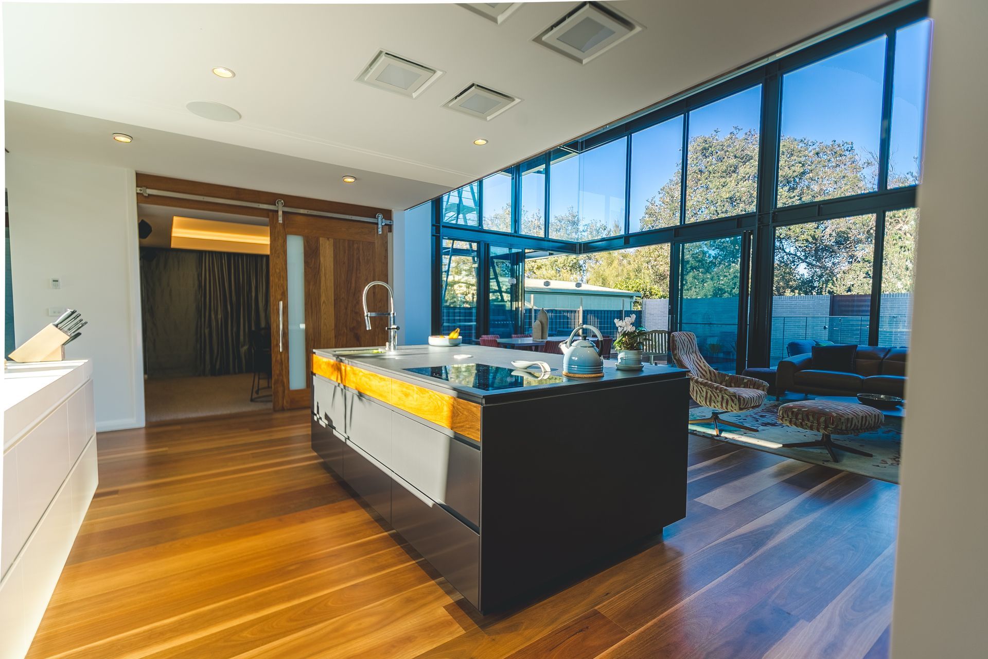 View of a kitchen island with windows overlooking a scenic view - Concept Kitchens in Port Macquarie NSW