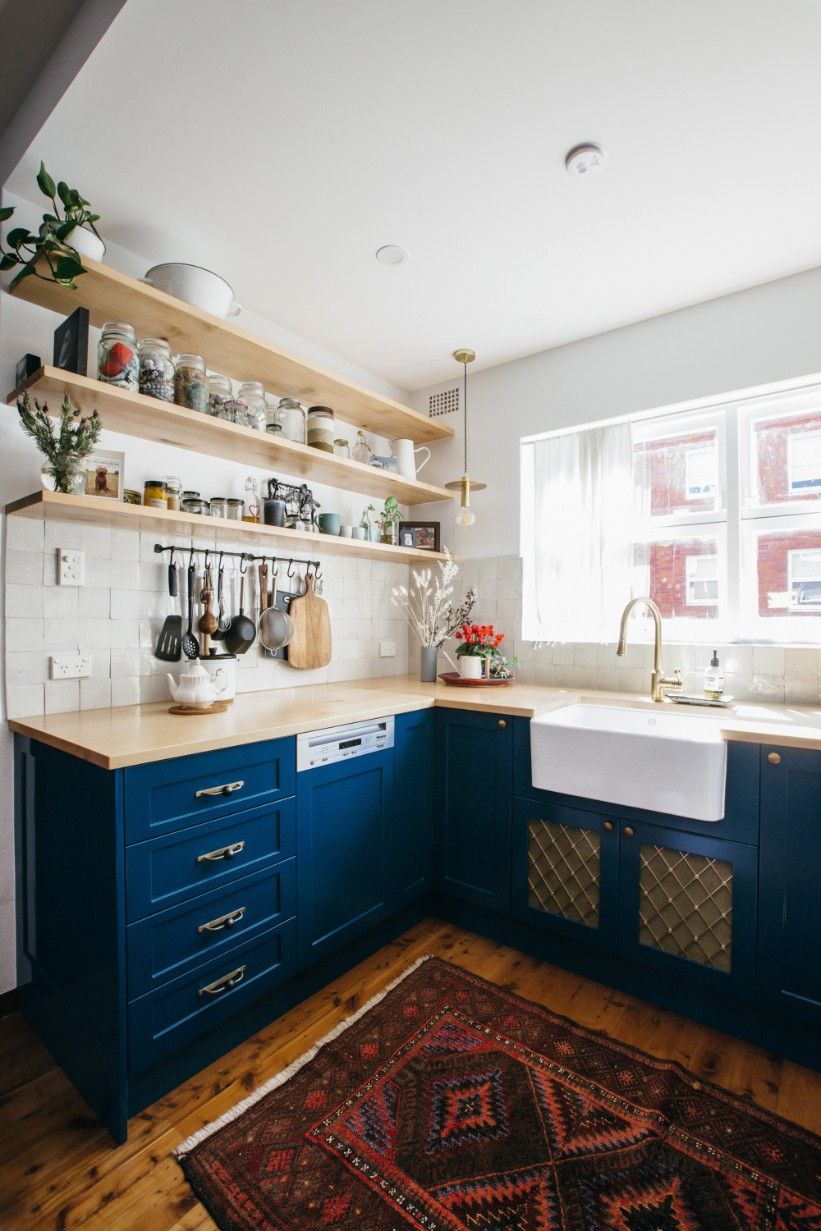 A Kitchen With Blue Cabinets, A Rug, A Sink And A Blue Countertop — Concept Kitchens In Port Macquarie, NSW