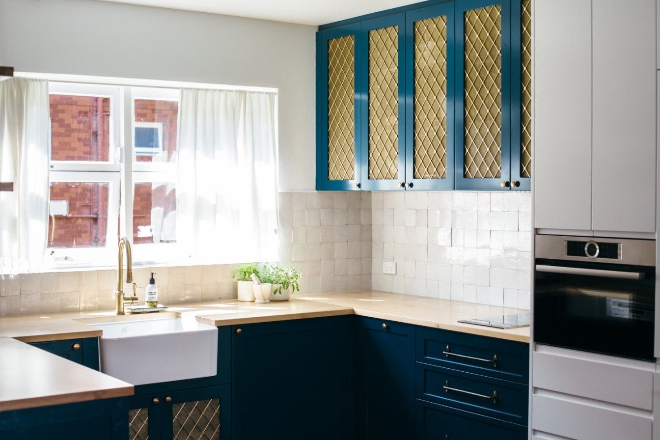 A Kitchen With Blue Gold Mesh Cabinets, A Sink, And A Window — Concept Kitchens In Port Macquarie, NSW