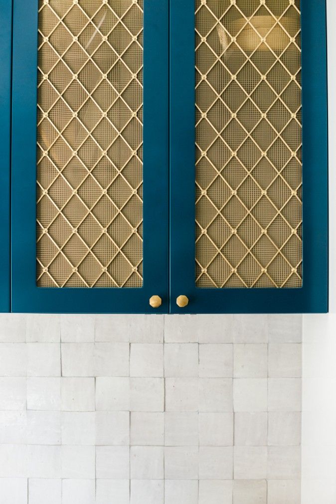 A Close Up Of A Blue Cabinet With A Gold Mesh Door — Concept Kitchens In Port Macquarie, NSW
